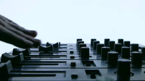 Professional sound engineer balancing volume of audio inputs of digital audio Stock Footage 170847820