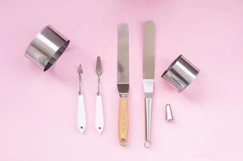 Professional spatula set for quick glazing of large cakes. Confectioner's t.. Stock Photos