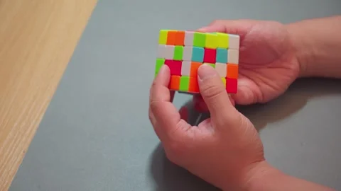 Professional speedcuber solving multi-layered magic cube close up Video stock 337688107