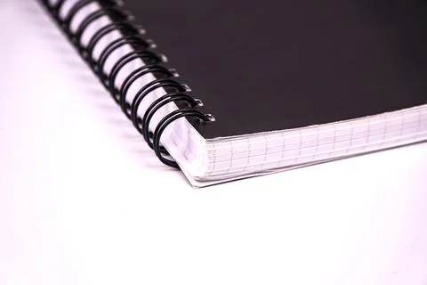 Professional spiral notebook stock image featuring black cover with white gri Stock Photos