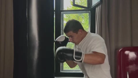Professional sport instructor practicing technique with boxing sports equipment Video stock 253508785