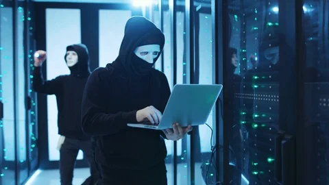 Professional spy copying server data with laptop technology at database. Data Stock Footage 120695223