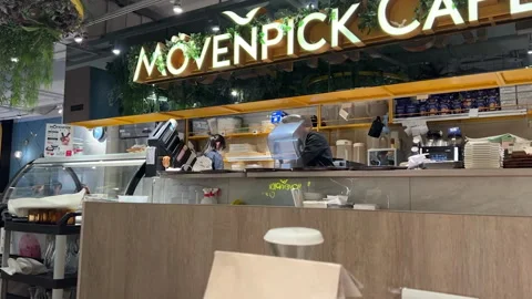 Professional Staff Working Behind the Counter at a Modern Movenpick Cafe Video stock 335874686