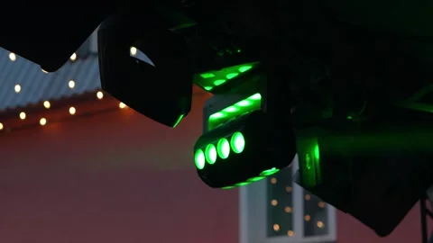 Professional stage lighting equipment glowing with bright red light outdoors. Stock Footage 341813724