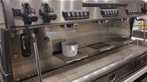 Professional stainless steel espresso machine with portafilter, coffee cup and Stock Footage 346549472