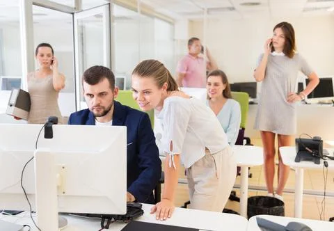 Professional start-up team working with pc and communicating 스톡 사진