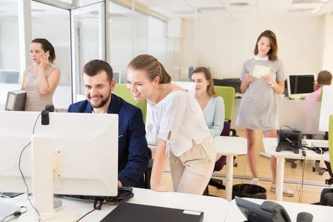 Professional start-up team working with pc and communicating Photos