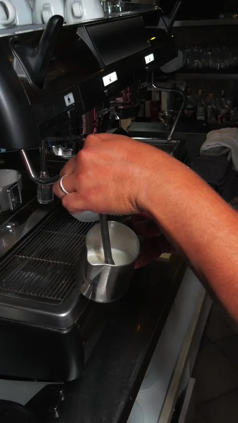Professional steaming of milk foam using industrial coffee machine Video stock 343912652