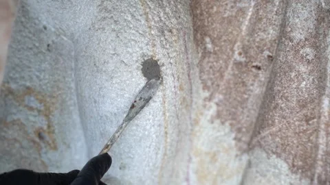 Professional Stone Restoration - Applying Conservation Mortar on Monument Facade Stock-Footage 331998128