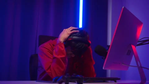 Professional Streamer gaming playing game online in dark room neon light. Gamer. Stock Footage 235653978
