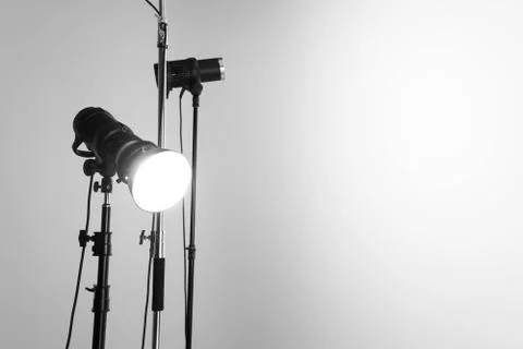 Professional studio flashes illuminating a blank space Stock Photos
