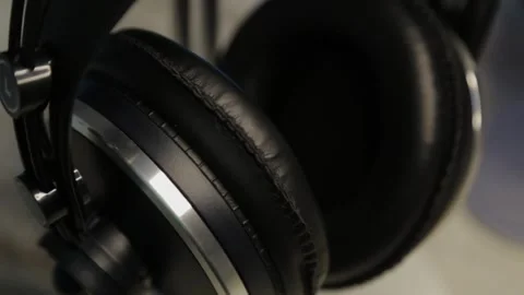 Professional studio headphones close-up, camera movement Stock Footage 306150248