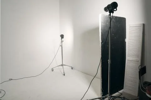 Professional studio light standing on white cyclorama. Stock Photos