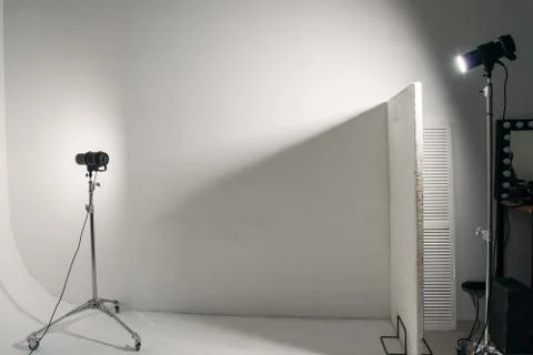 Professional studio light on white cyclorama. Photoshoot concept. Copy space Stock Photos