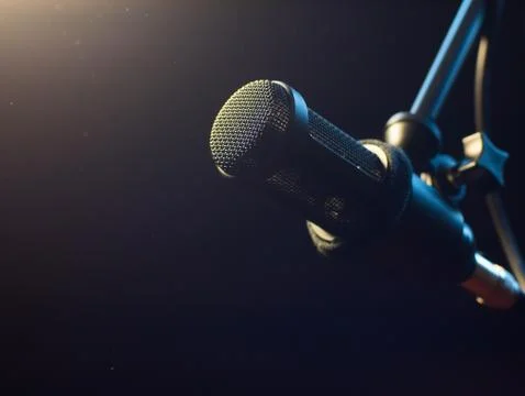 Professional Studio Microphone in recording studio. Lights on background Stock Photos