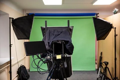 Professional Studio Setup with Green Screen and Lighting Equipment Photos