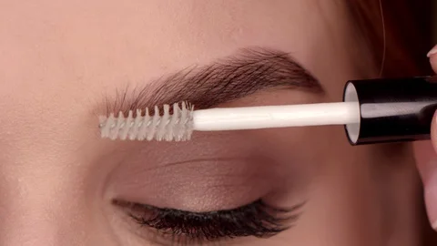 Professional styling eyebrows girls in the dressing room Stock Footage 112293489