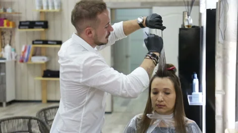 Professional stylist shows master class on hair coloring Stock Footage 69067104