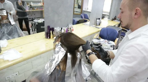 Professional stylist shows master class on hair coloring Stock Footage 69067442
