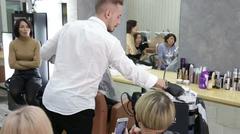 Professional stylist shows master class on hair coloring Stock Footage 69068736