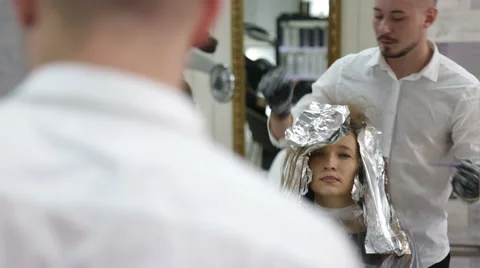 Professional stylist shows master class on hair coloring Stock Footage 69069180