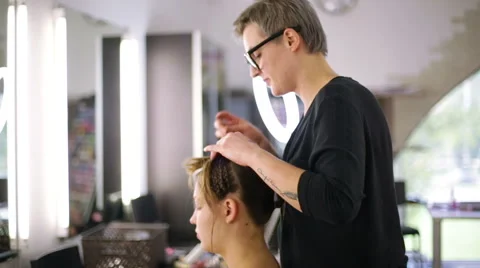 Professional stylists working on a way Video stock 68648324