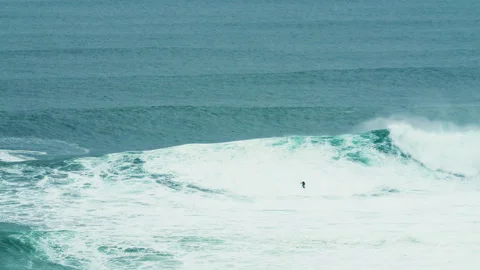 Professional surfer falling from surfboard into ocean near jet ski driver Video stock 163269045