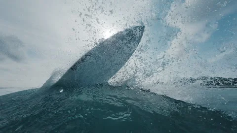 Professional surfer rides the wave and does snap trick with a lot of spray close Stock-Footage 321089126