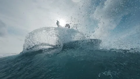Professional surfer rides the wave and does snap trick with a lot of spray close Stock-Footage 321089320