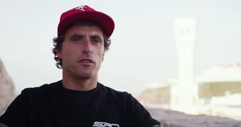 Professional surfer Sergio Cosme talking about his first surfing and big waves Stock Footage 156273283