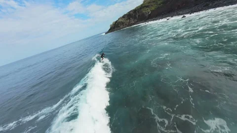 Professional surfer skillfully rides powerful ocean waves at Playa Nogales Video stock 308587419