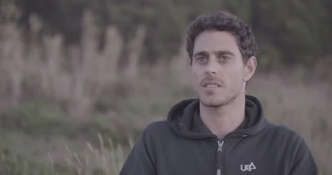 Professional surfer Tom Butler is talking about starting point in Big Wave Video stock 160122829