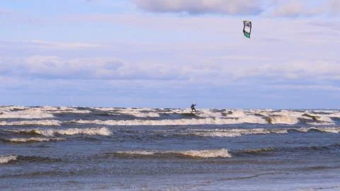 Professional surfer in the wind preparing the wind in the sea to the ocean. Stock Photos