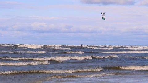 Professional surfer in the wind preparing the wind in the sea to the ocean. Stock Photos