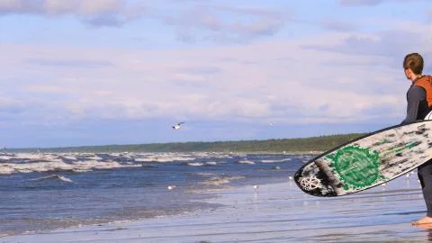 Professional surfer in the wind preparing the wind in the sea to the ocean. Stock Photos