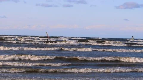 Professional surfer in the wind preparing the wind in the sea to the ocean. Stock Photos