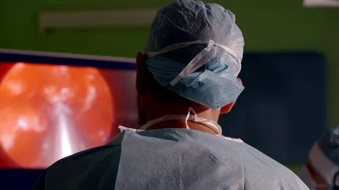 Professional surgeon conducting difficult endoscopy procedure. Stock Footage 83252207