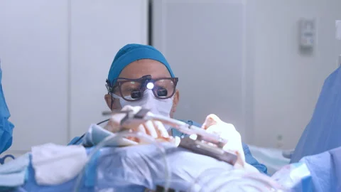 A professional surgeon performs heart surgery in a medical facility Stock Footage 253805931