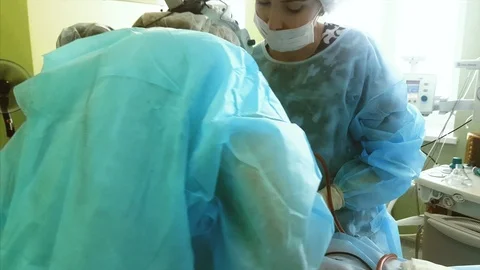 Professional surgeons performing difficult opeartion on a nose in a clinic. Stock Footage 116615012
