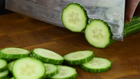 Professional Sushi chef cutting cucumber for rolls. Stock Footage 152847321