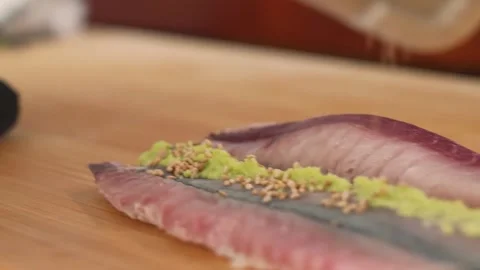 Professional Sushi Chef Preparing Fresh Horse Mackerel (Aji) with Wasabi and Gin Stock Footage 333600532