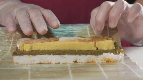 Professional sushi chef preparing roll at commercial kitchen, close-up. Stock Footage 82711615