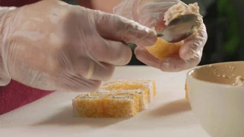 Professional sushi chef preparing roll at commercial kitchen, close-up. Stock Footage 82713008