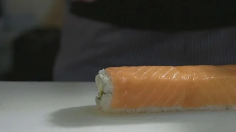 Professional sushi chef preparing roll at commercial kitchen, close-up. Stock Footage 82752262