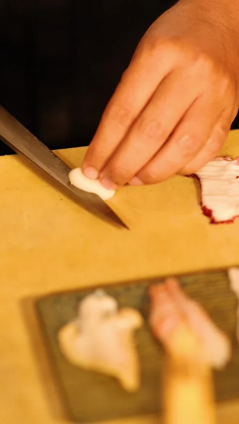 Professional Sushi Chef Slicing Fresh Octopus Sashimi on Wooden Board Stock Footage 340247390