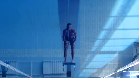 A professional swimmer dives into the pool, picking up a lot of splashes Stock Footage 119501032