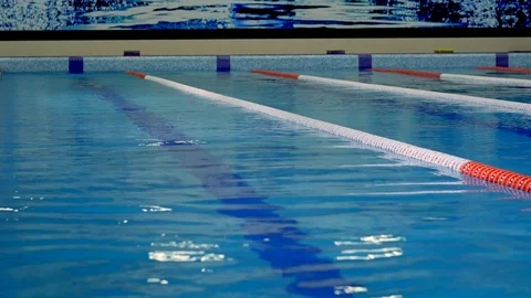 Professional swimmer during training in the pool before the championship Stock Footage 99180887