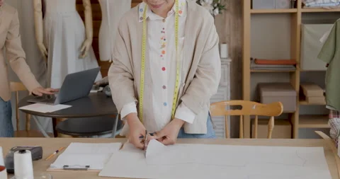 Professional Tailor Cutting Fabric Pattern In Creative Sewing Studio Medium.. Stock Footage 336247958