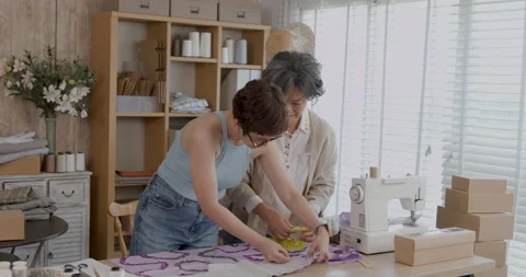 Professional Tailors Measuring Fabric Pattern In Modern Design Studio Works.. Stock Footage 340135023