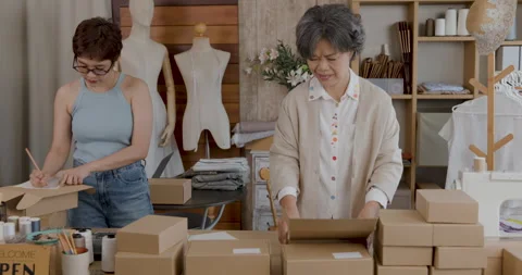 Professional Tailors Packaging Handmade Clothing Orders In Studio Workshop .. Stock Footage 337086715
